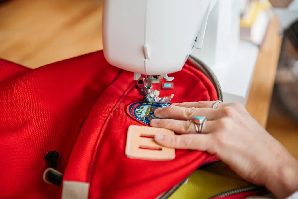 sew on a patch on clothing